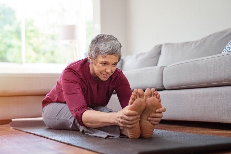 survivor practicing exercises to help her foot drop after tbi