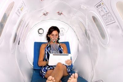 woman with spinal cord injury using oxygen therapy to promote healing 