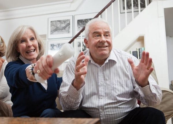 two stroke survivors playing videos games to promote recovery